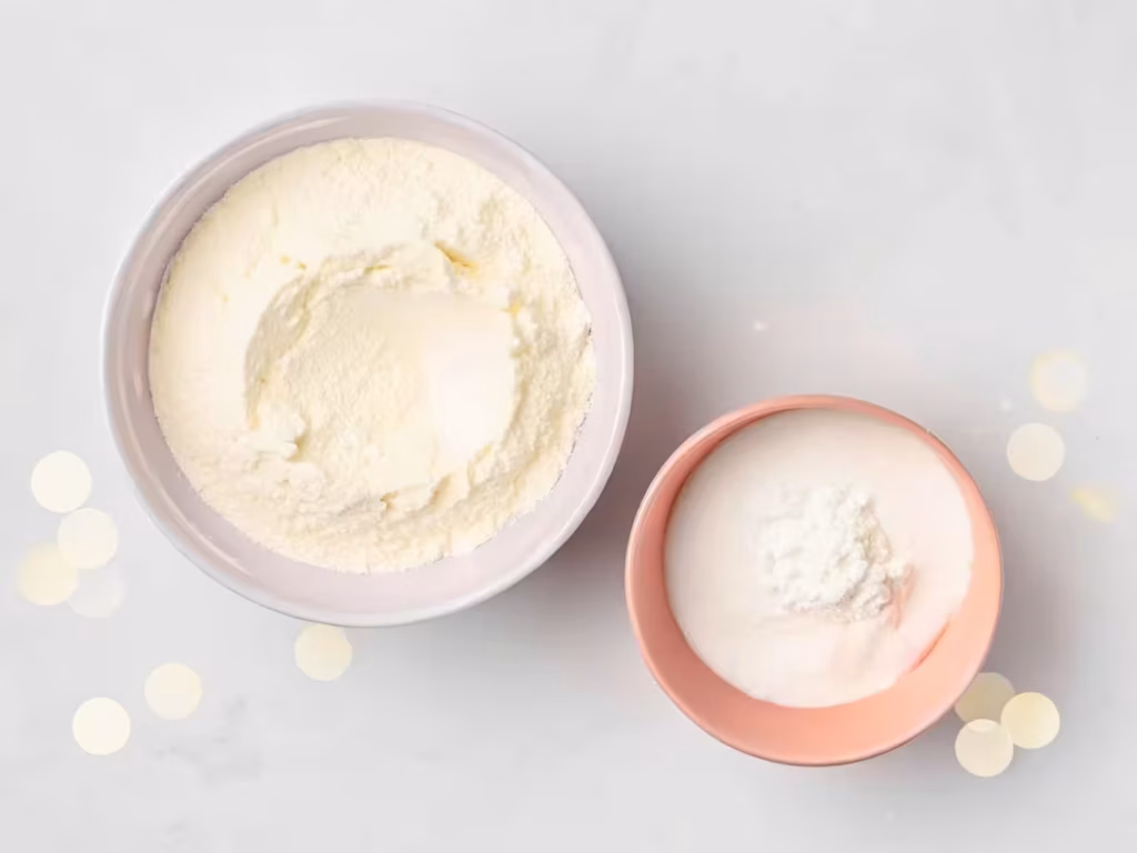 The two simple ingredients for high protein bagels: a bowl of Greek yogurt and a bowl of self-rising flour.